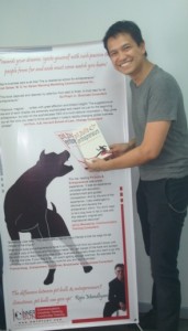 Friend and Author Ramon (Mon) Garcia feeding my ego.